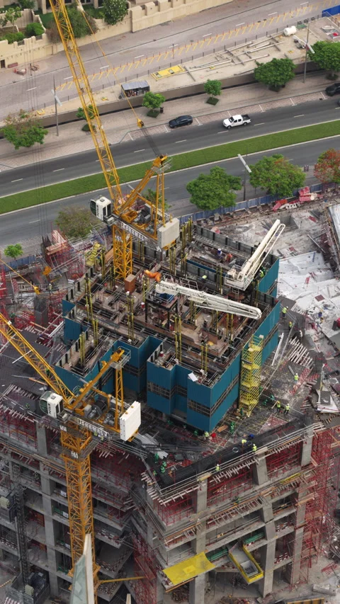 Timelapse of a skyscraper construction site in Dubai with Potain cranes Stock Footage 341775769