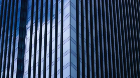 Timelapse skyscraper glass surface blue sky clouds reflected on windows glass Stock Footage 200879209