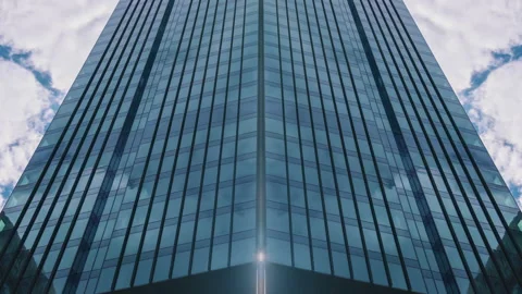 Timelapse skyscraper glass surface, blue sky and clouds reflected in windows Stock Footage 200880876