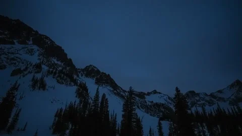 Timelapse slider pan across mountain range at night stars clouds Stock Footage 167053769