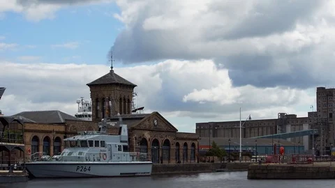 Timelapse of a small boat bobbing in front of the Forth Ports Limited building Stock Footage 77660069