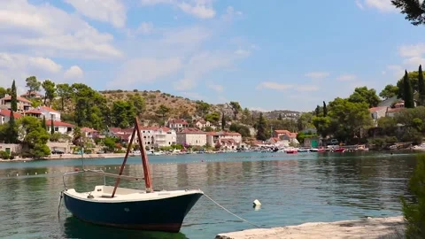 Timelapse of a small old harbour on the island of Brac. Old boats rocking on  Stock Footage 137793601