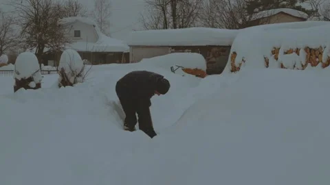 Timelapse of snow digging, digging snow on the house site Stock Footage 328875735