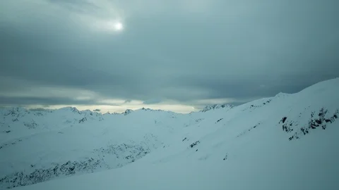 Timelapse of snow storm clouds floating across sky with sun beaming through Stock Footage 124238827
