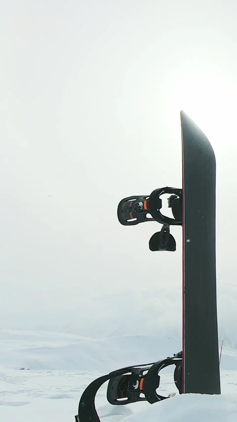 Timelapse Snowboard in snow under dynamic cloudy winter sky with mountain p.. Stock Footage 311881734