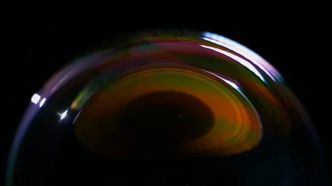 Timelapse soap bubble closeup on black background bursts Видео 128998499