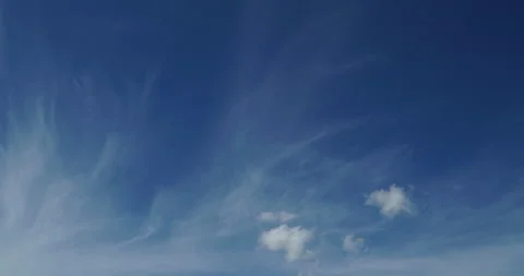 Timelapse of soft white cumulus clouds move in the blue sky Video stock 298272436