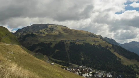 Timelapse of some clouds in a mountain landscape. Green mountains. Mountain v Video stock 146446624