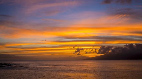 Timelapse of Spectacular Sunset Light on Smoothly Moving Clouds from Maui Stock Footage 128996206