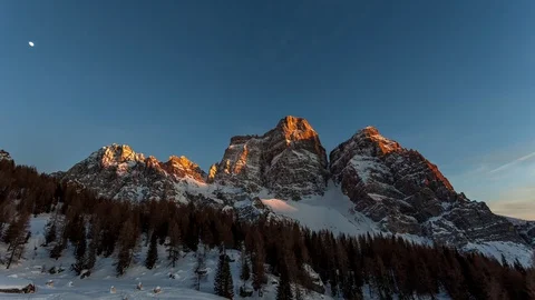Timelapse of spectacular sunset on a snow-covered Dolomite mountain Stock Footage