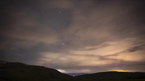 Timelapse of a starry night sky with clouds moving over the Pyrenees mounta.. Stock Footage 325676475