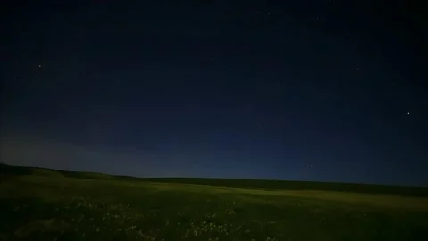 Timelapse of a Starry Night Sky with a Meteor Streak over Rural China Stock Footage 337442363