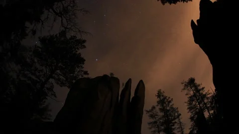 Timelapse of the starry sky above the mountain peaks in the Siberian forest. Stock Footage 88982191