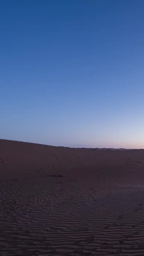 Timelapse of Starry Sky Over Tengger Desert Dunes at Dawn Stock Footage 345367061