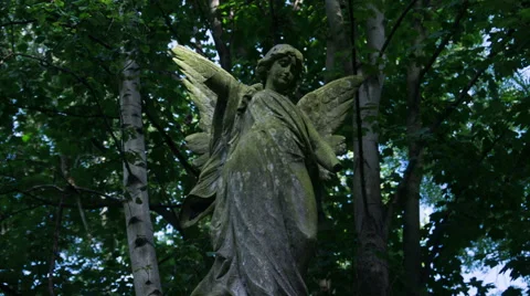 Timelapse Statue headstone in cemetery Stock Footage 64940861