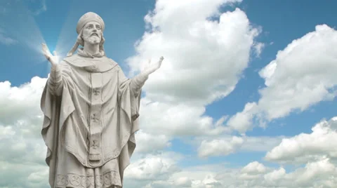 Timelapse of the statue of a priest with light streaks coming through hands Stock Footage 35987932