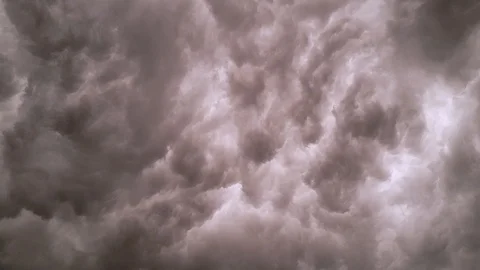 TIMELAPSE STEADY Backside illuminated dark supercell storm cloud moving Stock Footage 110570450