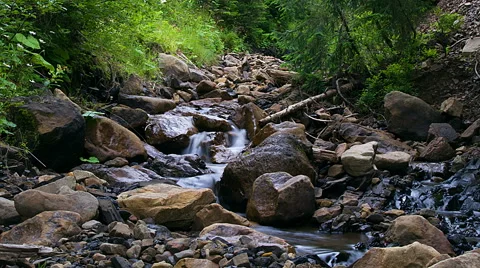 Timelapse of stones in the mountain river Stock Footage 64859590