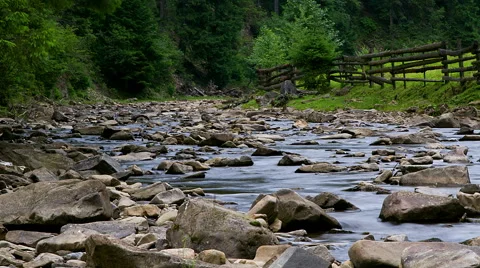 Timelapse of stones in the mountain river Stock Footage 65498653