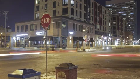 Timelapse of a Stop Sign and Traffic at Night Stock Footage 85575190