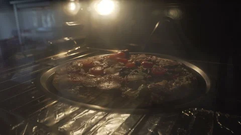 Timelapse of Store Bought Pizza Quickly Cooking in an Oven Stock Footage 106327718
