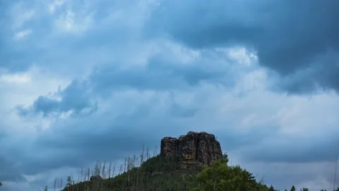 Timelapse of storm clouds above the hill in the forest Stock Footage 132255977