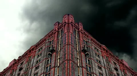 Timelapse storm clouds behind old derelict victorian warehouse Stock Footage 10794077