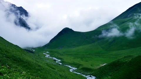 Timelapse of storm clouds fill the valley and greatly reduce visibility in high Stock-Footage 65992895