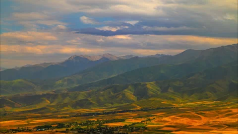 Timelapse of storm clouds flowing above green mountains Stock Footage 335688826