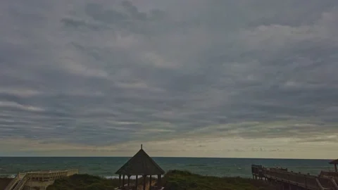 Timelapse Of Storm Clouds Over The Ocean With Waves Crashing Stock Footage 219128824
