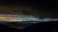Timelapse Of Storm Clouds Rolling Thru City Lights In Los Angeles -Pan Left- Stock Footage
