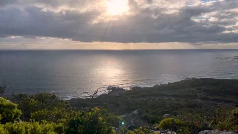 Timelapse of a storm coming in over the ocean at sunset Stock Footage 168833699
