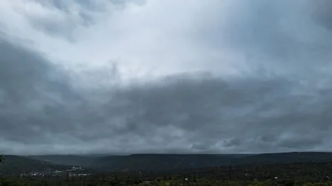 Timelapse of a Storm Enveloping a Mountain Town with Visible Raindrops Stock Footage 278285739