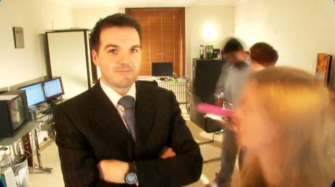 Timelapse in studio office with busy team rushing around and one individual Vídeo Stock 32964212
