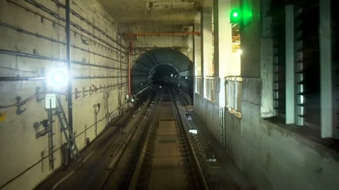 Timelapse of Subway Train Driving Through Dark Tunnel Stock Footage 115629656