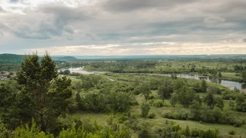 Timelapse. Summer valley landscape with river, hills, running clouds Video stock 132711844