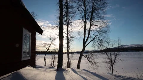Timelapse of sun and clouds over winter landscape with barn 4K Stock Footage 232292575