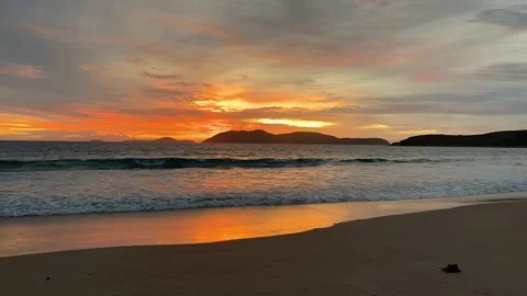 Timelapse - the sun appears between mountains on the horizon at the bottom .. Stock Footage 236074595