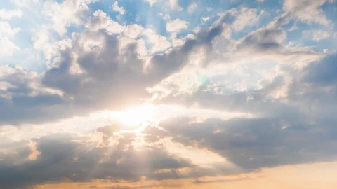 Timelapse: sun beams shining through moving dramatic white clouds - hope concept Stock Footage