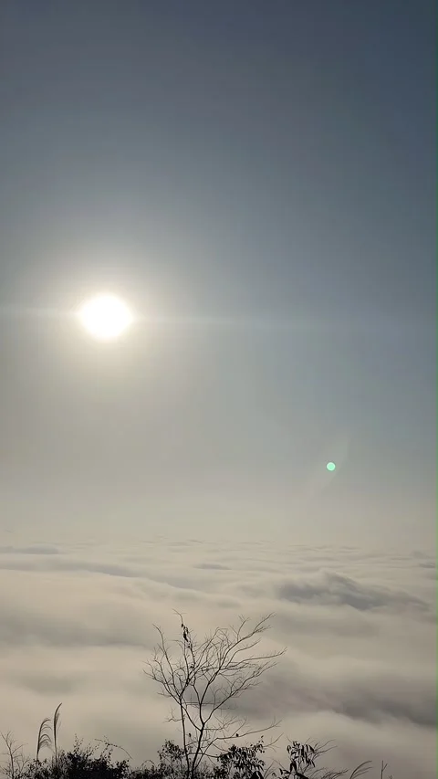 Timelapse of Sun Breaking Through a Sea of Clouds from a Mountain Peak, China Stock Footage 336829148