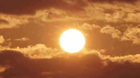 Timelapse of sun close-up rising over mountain horizon.  Stock Footage 305159242