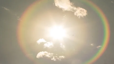 TIMELAPSE INTO THE SUN CLOUD RAINBOW Stock Footage 32351726