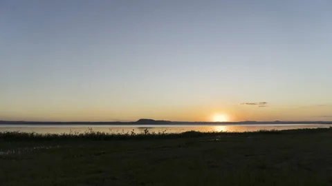 Timelapse of sun down at ypacarai lake in san bernardino paraguay Stock Footage 249550957