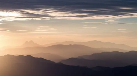 Timelapse of sun light rays in the mountains during sunset. Stock Footage 68711528