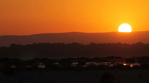 Timelapse of sun motion while hiding behind mountain golden hour Stock Footage 148242093