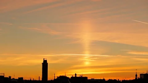 Timelapse of sun pillar phenomenon above city skyline silhouette Stock-Footage 51876397