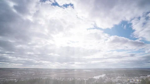 Timelapse of Sun Rays Breaking Through Clouds Over Vast Landscape Stock Footage 309531503
