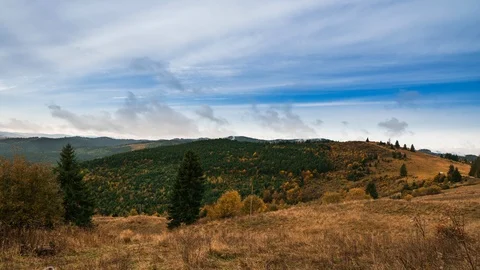 Timelapse of sun rays mountains and trees Stock Footage 121814649