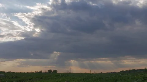 Timelapse sun rays through the clouds. Field, grass. Stock Footage 75603852