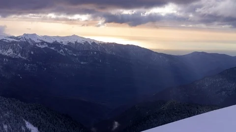 Timelapse sun rays through the clouds at sunset in mountains of caucasus Stock Footage 93091448